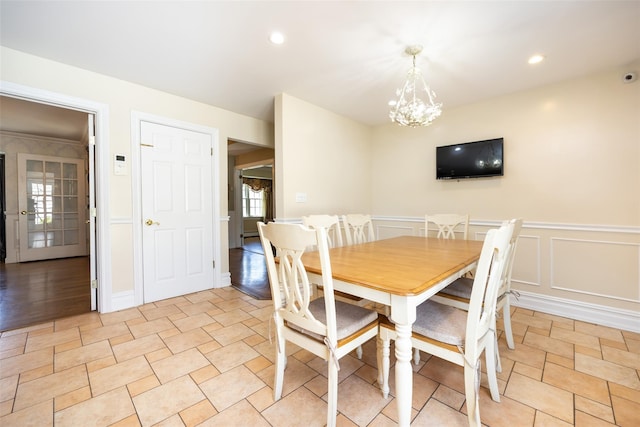 30 Knoll Ln, Glen Head, NY 11545 - dining space featuring a chandelier, wainscoting, a decorative wall, and recessed lighting