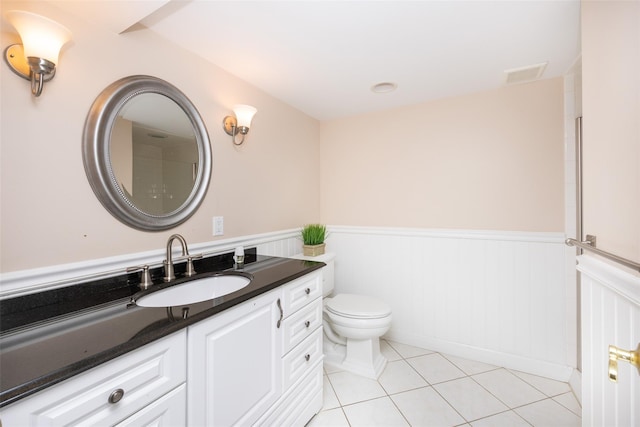 30 Knoll Ln, Glen Head, NY 11545 - bathroom featuring wainscoting, vanity, toilet, and tile patterned flooring