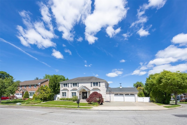 30 Knoll Ln, Glen Head, NY 11545 - view of front facade with driveway, stone siding, and an attached garage