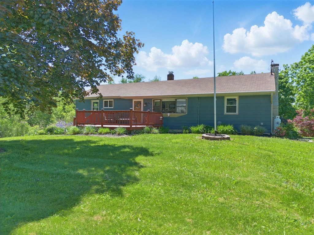 484 Noxon Rd, Poughkeepsie, NY 12603 - rear view of property with a chimney, a wooden deck, and a lawn