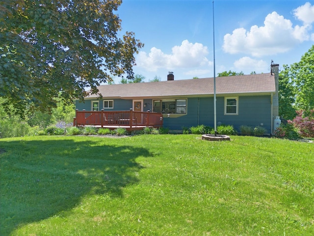 484 Noxon Rd, Poughkeepsie, NY 12603 - rear view of property with a chimney, a wooden deck, and a lawn