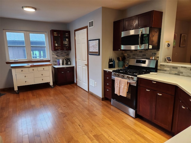 182 Ledge Rd, Kingston, NY 12401 - kitchen featuring appliances with stainless steel finishes, backsplash, and light countertops