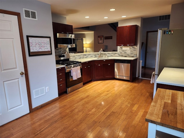 182 Ledge Rd, Kingston, NY 12401 - kitchen with stainless steel appliances, tasteful backsplash, light countertops, light wood finished floors, and recessed lighting