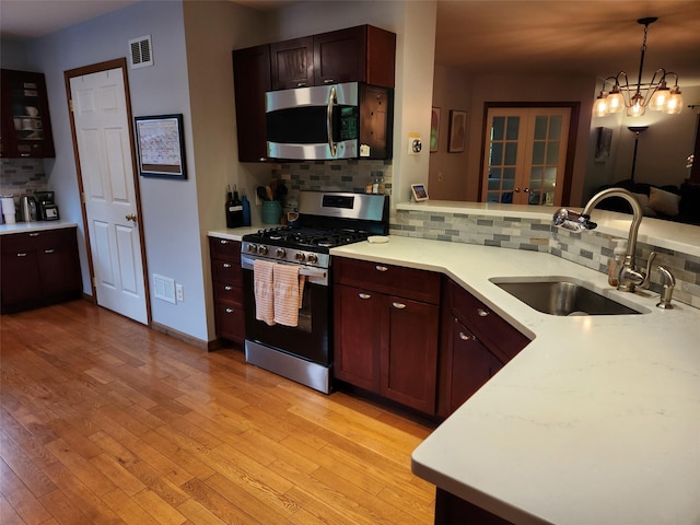 182 Ledge Rd, Kingston, NY 12401 - kitchen with appliances with stainless steel finishes, a sink, decorative backsplash, light countertops, and french doors
