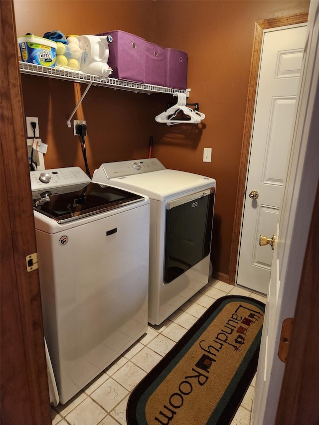 182 Ledge Rd, Kingston, NY 12401 - laundry room featuring washing machine and clothes dryer and light tile patterned floors