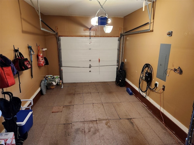 182 Ledge Rd, Kingston, NY 12401 - garage with a garage door opener, baseboards, and electric panel