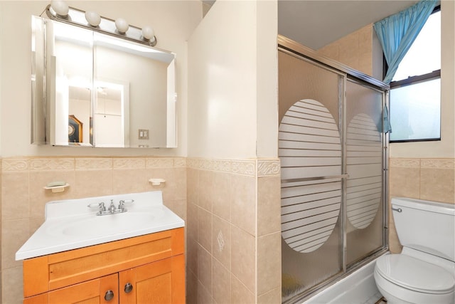 160-15 Powells Cove Blvd Unit D203, Beechhurst, NY 11357 - full bath featuring tile walls, toilet, a shower with door, vanity, and a wainscoted wall