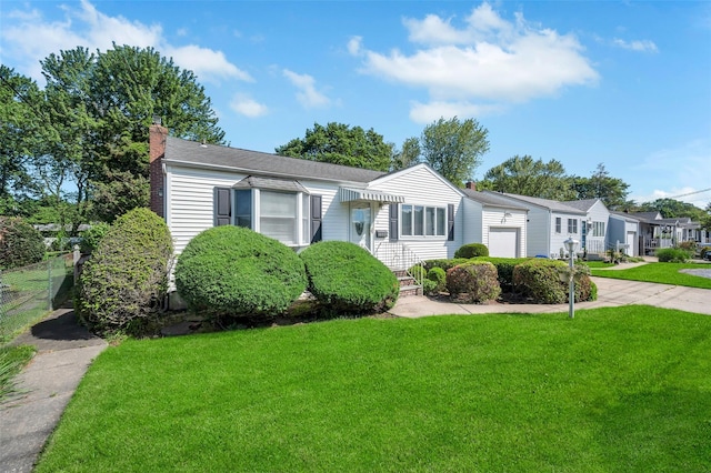 383 Old Country Rd, Deer Park, NY 11729 - view of front of home featuring a chimney, a front yard, a garage, and driveway