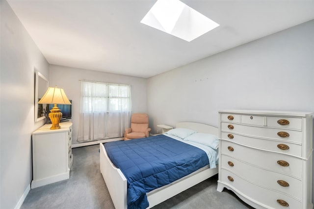 383 Old Country Rd, Deer Park, NY 11729 - carpeted bedroom featuring a skylight and a baseboard heating unit