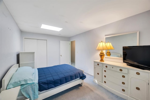 383 Old Country Rd, Deer Park, NY 11729 - bedroom with a skylight, light carpet, a closet, and baseboards