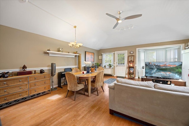 133-20 87th St Unit 3, Ozone Park, NY 11417 - dining space featuring vaulted ceiling, a chandelier, light wood-style flooring, and ceiling fan