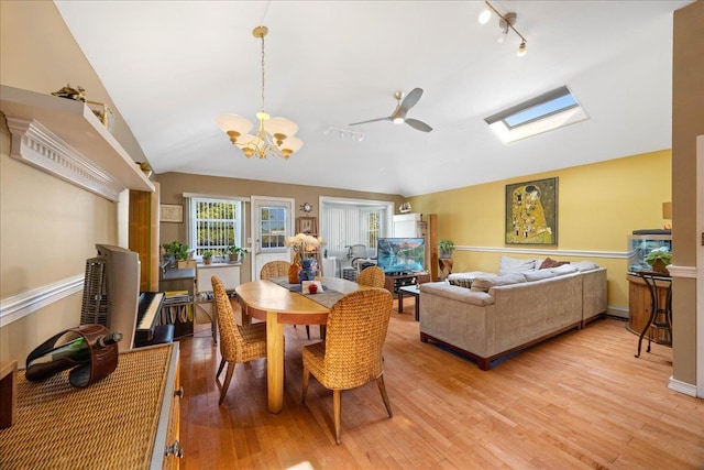 133-20 87th St Unit 3, Ozone Park, NY 11417 - dining area with lofted ceiling, light wood-style flooring, a chandelier, rail lighting, and a skylight