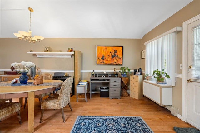 133-20 87th St Unit 3, Ozone Park, NY 11417 - dining space featuring a chandelier, vaulted ceiling, and light wood-style flooring