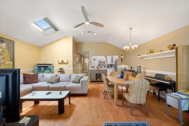 133-20 87th St Unit 3, Ozone Park, NY 11417 - living room with a chandelier, lofted ceiling, ceiling fan, light wood finished floors, and a skylight