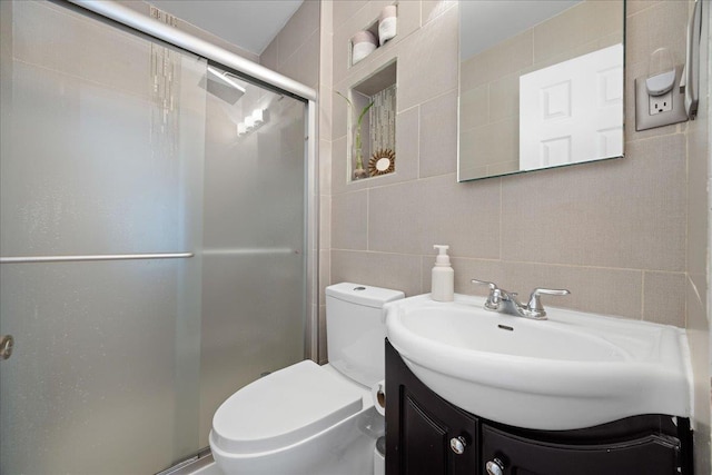133-20 87th St Unit 3, Ozone Park, NY 11417 - full bath featuring tile walls, a stall shower, vanity, toilet, and tasteful backsplash