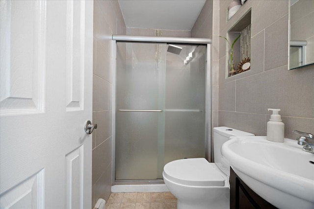 133-20 87th St Unit 3, Ozone Park, NY 11417 - bathroom with tile walls, toilet, a shower stall, and vanity