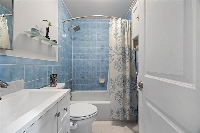 133-20 87th St Unit 3, Ozone Park, NY 11417 - full bath featuring vanity, shower / bath combo with shower curtain, toilet, tile patterned floors, and tile walls