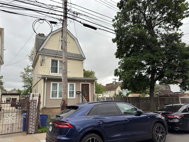 117-67 140th St, Jamaica, NY 11420 - view of front of home featuring a chimney and a gambrel roof