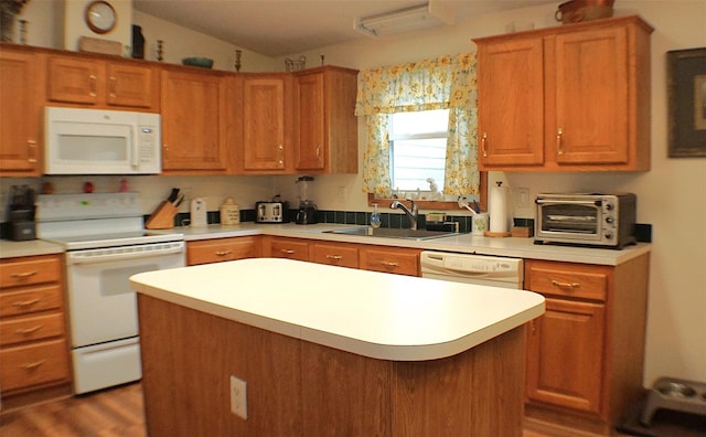 26 Saunders Ln, Wawarsing, NY 12489 - kitchen with white appliances, a sink, light countertops, a center island, and wood finished floors