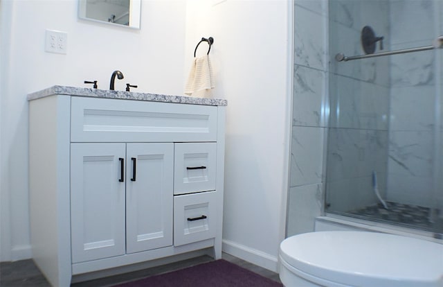 26 Saunders Ln, Wawarsing, NY 12489 - full bathroom featuring baseboards, a shower stall, vanity, and toilet