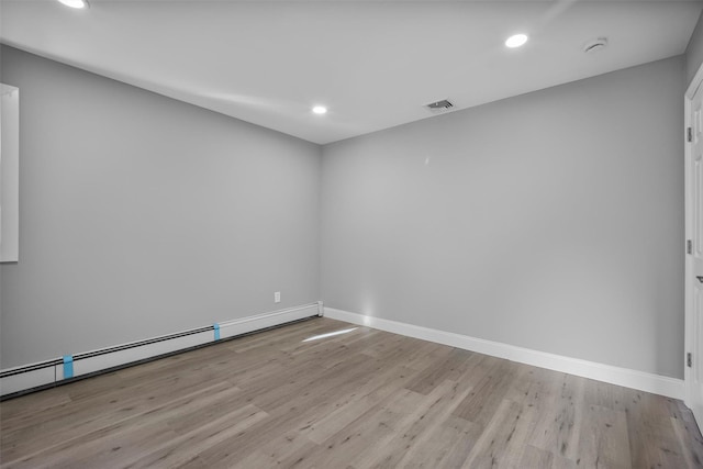 1345 Rte 82, Hopewell Junction, NY 12533 - spare room featuring wood finished floors, baseboard heating, baseboards, recessed lighting, and a smoke detector