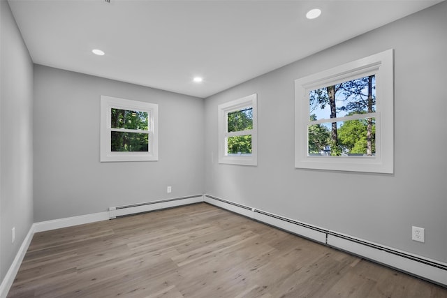 1345 Rte 82, Hopewell Junction, NY 12533 - unfurnished room with wood finished floors, a baseboard heating unit, recessed lighting, and baseboards