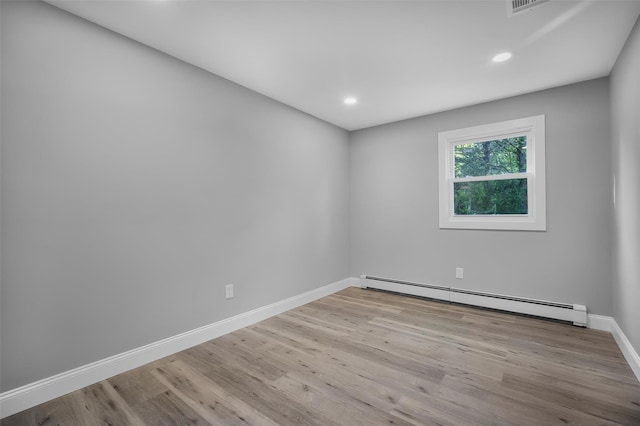 1345 Rte 82, Hopewell Junction, NY 12533 - empty room featuring a baseboard heating unit, wood finished floors, baseboards, and recessed lighting