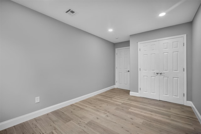 1345 Rte 82, Hopewell Junction, NY 12533 - unfurnished bedroom with baseboards, light wood-style flooring, recessed lighting, and a closet