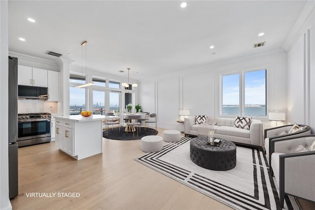 90 Bay Street Lndg Unit 6L, Staten Island, NY 10301 - living room with healthy amount of natural light, crown molding, light wood finished floors, recessed lighting, and a chandelier