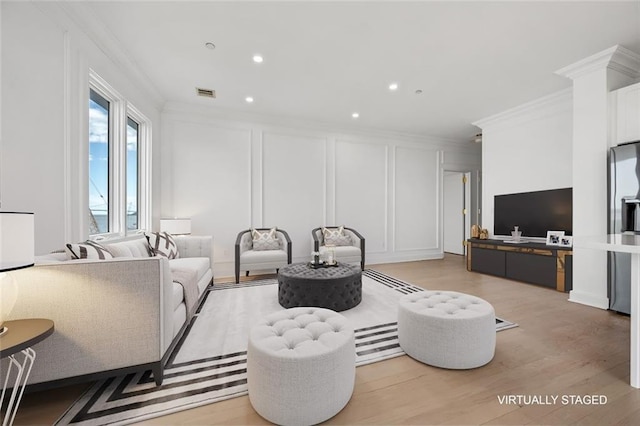90 Bay Street Lndg Unit 6L, Staten Island, NY 10301 - living area featuring a decorative wall, ornamental molding, light wood-style flooring, and recessed lighting