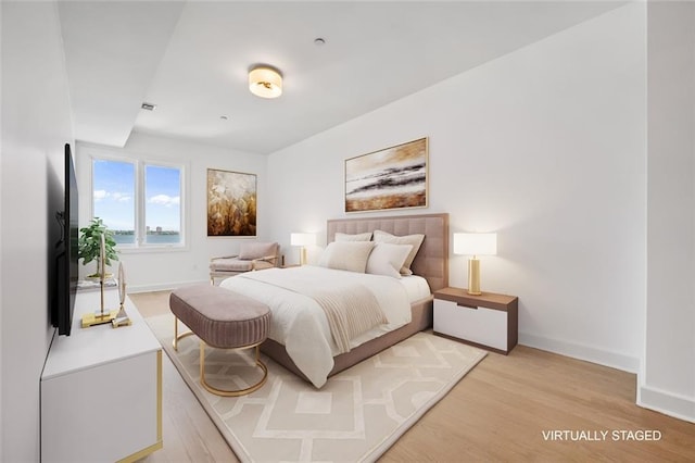 90 Bay Street Lndg Unit 6L, Staten Island, NY 10301 - bedroom with light wood-type flooring and baseboards