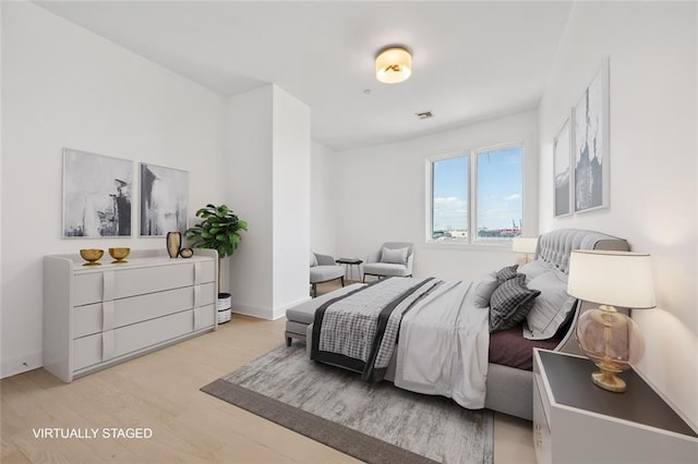 90 Bay Street Lndg Unit 6L, Staten Island, NY 10301 - bedroom featuring light wood-style flooring and baseboards