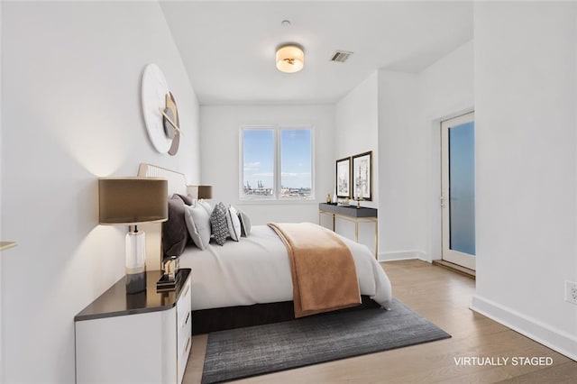 90 Bay Street Lndg Unit 6L, Staten Island, NY 10301 - bedroom with wood finished floors and baseboards