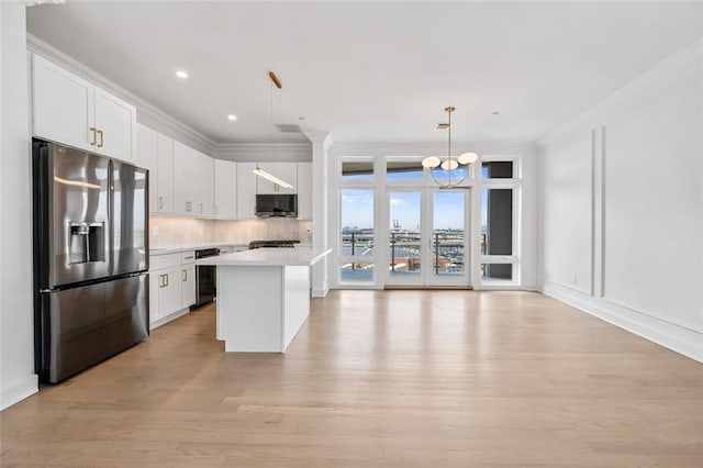 90 Bay Street Lndg Unit 6L, Staten Island, NY 10301 - kitchen with appliances with stainless steel finishes, light wood-type flooring, light countertops, a center island, and a chandelier