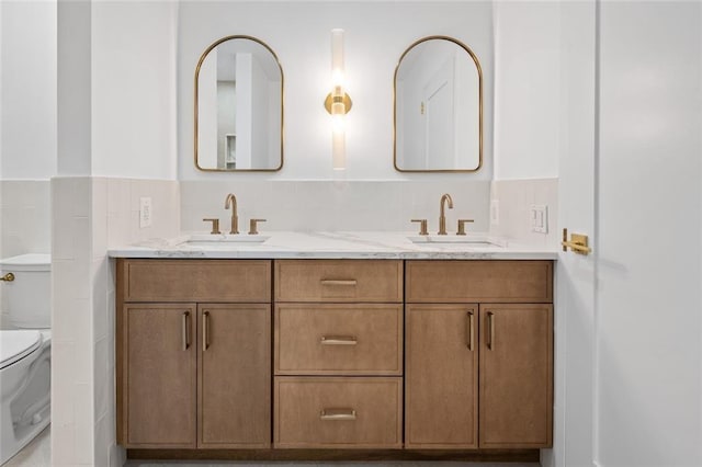 90 Bay Street Lndg Unit 6L, Staten Island, NY 10301 - full bathroom with toilet, double vanity, and a wainscoted wall