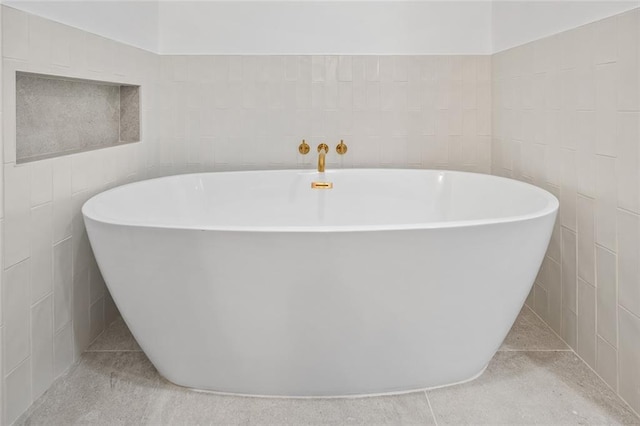 90 Bay Street Lndg Unit 6L, Staten Island, NY 10301 - bathroom featuring a freestanding tub and tile walls