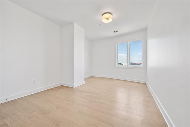 90 Bay Street Lndg Unit 6L, Staten Island, NY 10301 - spare room featuring light wood-type flooring and baseboards
