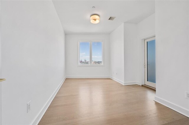 90 Bay Street Lndg Unit 6L, Staten Island, NY 10301 - unfurnished room with light wood-type flooring and baseboards