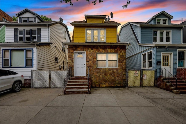 40-14 79th St, Elmhurst, NY 11373 - view of front of home with stone siding and entry steps