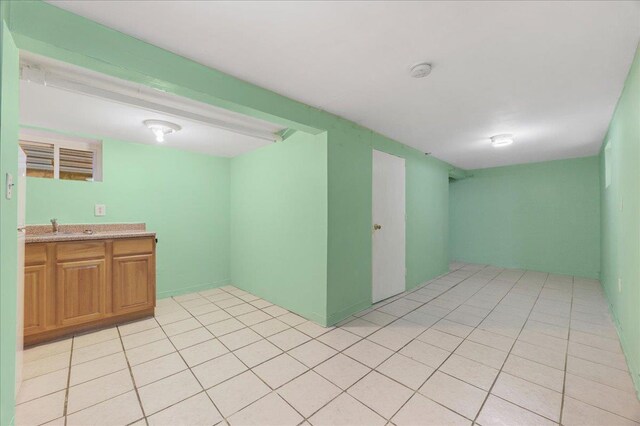 40-14 79th St, Elmhurst, NY 11373 - empty room with a sink and light tile patterned floors