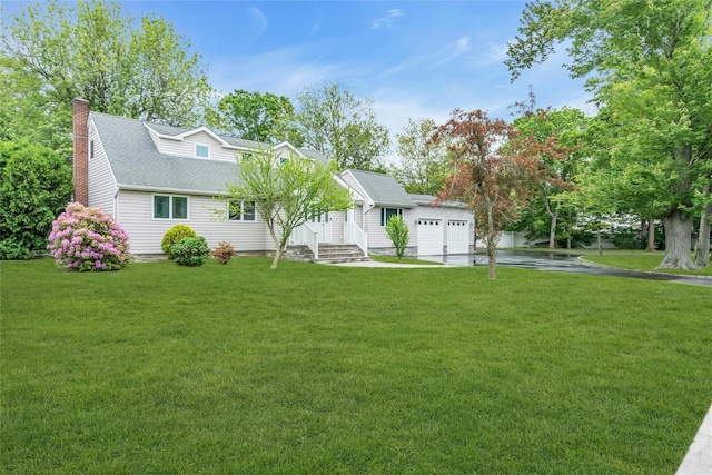 105 Browns Rd, Nesconset, NY 11767 - view of front facade featuring driveway, a chimney, roof with shingles, and a front yard