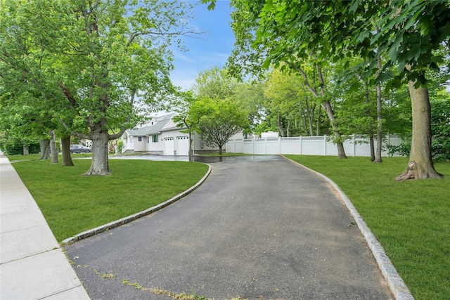 105 Browns Rd, Nesconset, NY 11767 - view of front of home featuring asphalt driveway and an attached garage