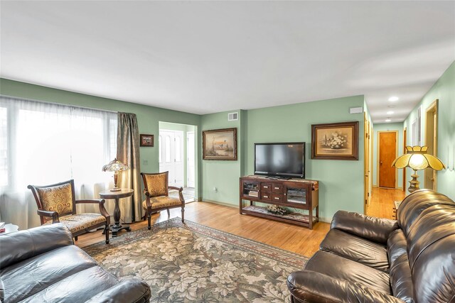 105 Browns Rd, Nesconset, NY 11767 - living area featuring wood finished floors and baseboards