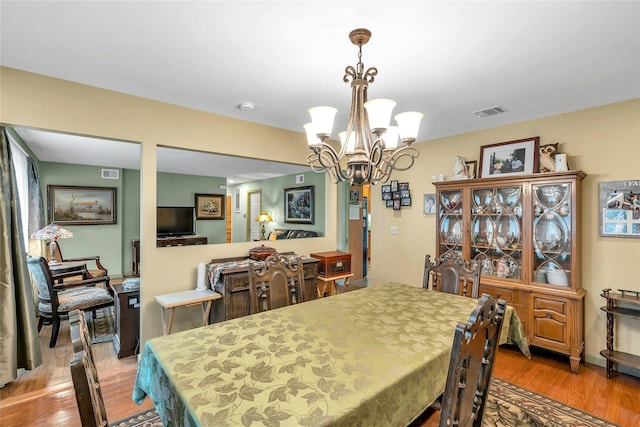 105 Browns Rd, Nesconset, NY 11767 - dining room featuring a chandelier and light wood-style floors