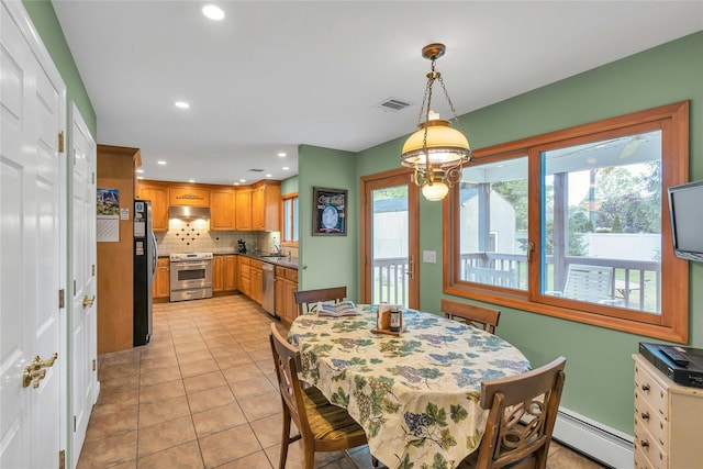 105 Browns Rd, Nesconset, NY 11767 - dining area with a baseboard radiator, light tile patterned floors, and recessed lighting
