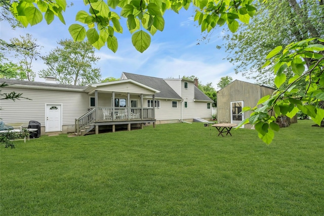 105 Browns Rd, Nesconset, NY 11767 - rear view of house featuring a yard and a wooden deck