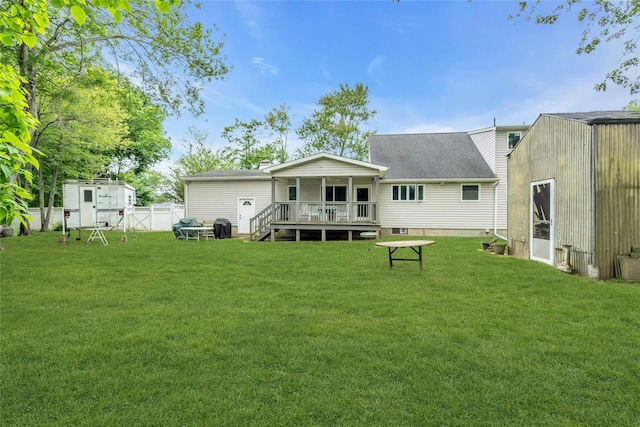 105 Browns Rd, Nesconset, NY 11767 - back of property featuring roof with shingles and a wooden deck