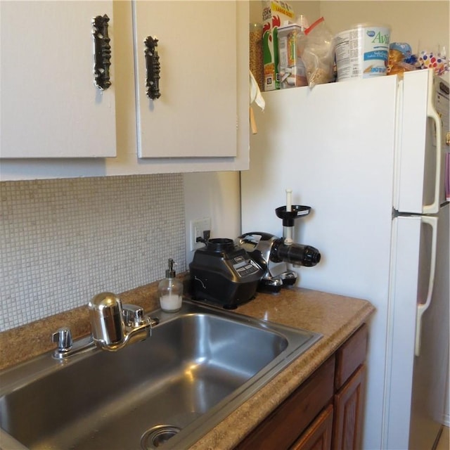29 Abeel St Unit 6K, Yonkers, NY 10705 - kitchen featuring a sink, backsplash, freestanding refrigerator, and brown cabinets