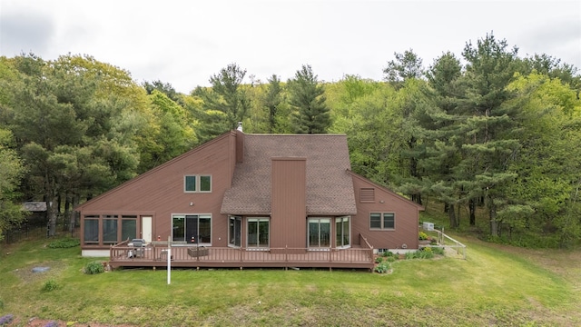 25 Ridge Rd, East Chatham, NY 12060 - back of property featuring a wooded view, a yard, a deck, and roof with shingles