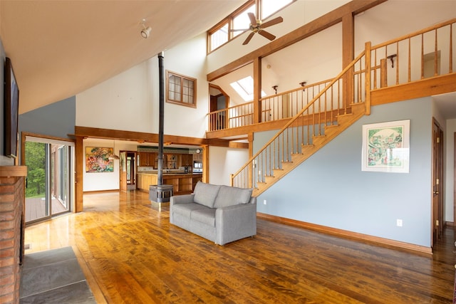 25 Ridge Rd, East Chatham, NY 12060 - unfurnished living room featuring high vaulted ceiling, a ceiling fan, wood finished floors, baseboards, and stairs
